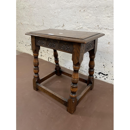 110 - A 17th century style carved oak joint side table - approx. 47cm high x 46cm wide x 25cm deep