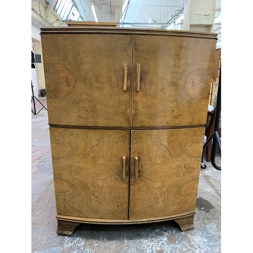 114 - An Art Deco style walnut four door cocktail cabinet - approx. 103cm high x 75cm wide x 44cm deep