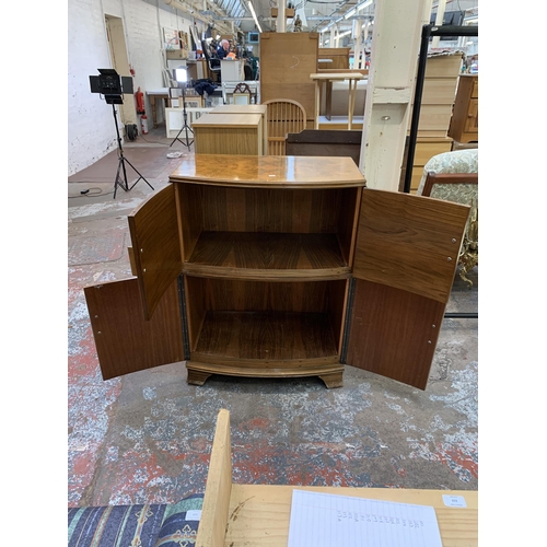 114 - An Art Deco style walnut four door cocktail cabinet - approx. 103cm high x 75cm wide x 44cm deep