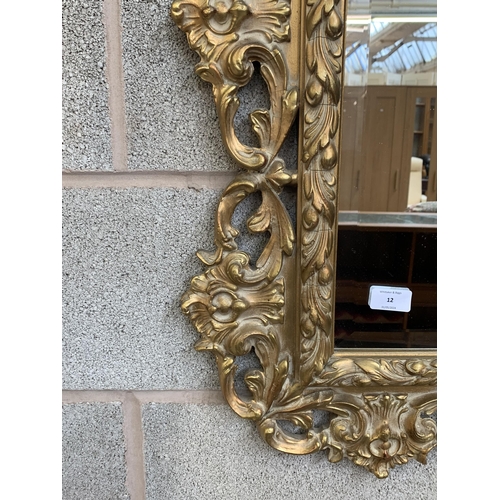 12 - A Rococo style gilt framed bevelled edge wall mirror - approx. 138cm high x 90cm wide