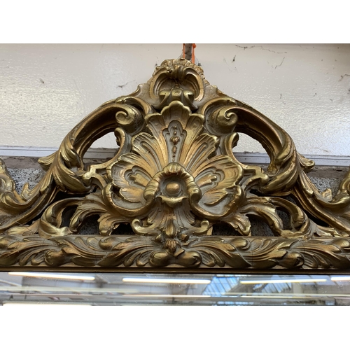 12 - A Rococo style gilt framed bevelled edge wall mirror - approx. 138cm high x 90cm wide