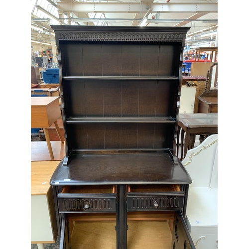 120 - A carved oak dresser - approx. 172cm high x 90cm wide x 42cm deep