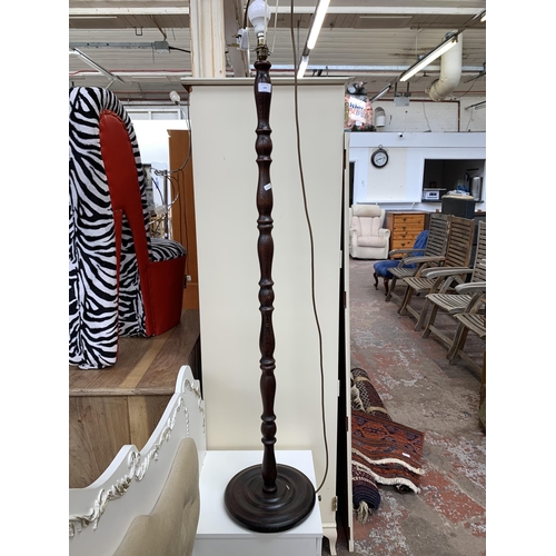 123 - A mid 20th century beech standard lamp with circular base - approx. 140cm high