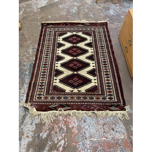 125 - A mid/late 20th century machine woven rug - approx. 200cm x 140cm