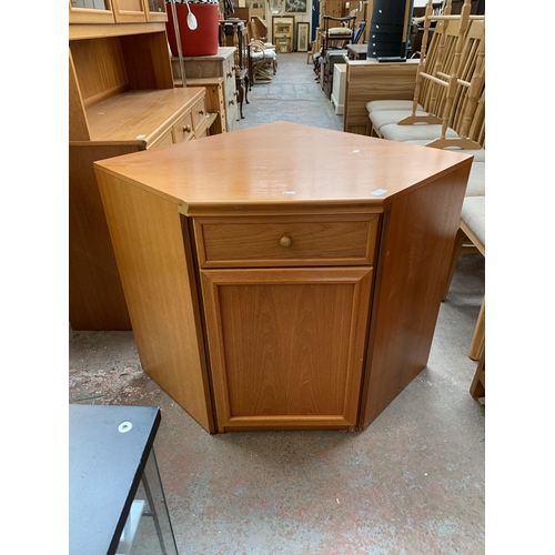 132 - A mid 20th century teak corner unit