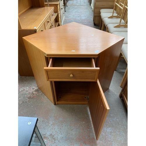 132 - A mid 20th century teak corner unit