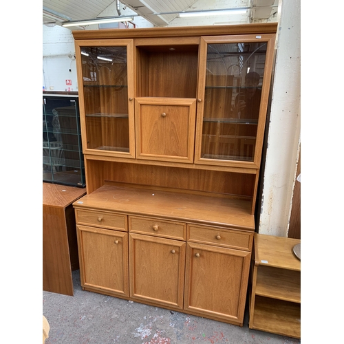 133 - A mid 20th century teak display unit