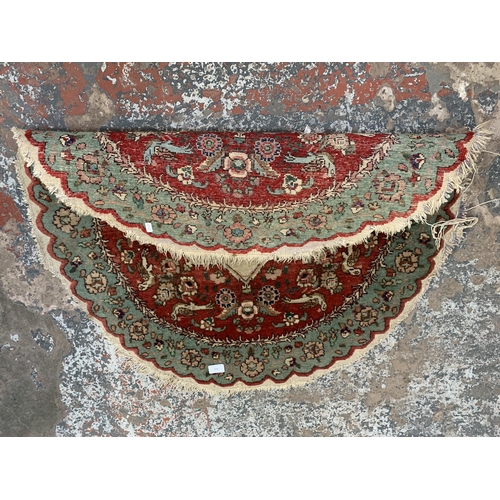 153 - A floral pattern circular rug - approx. 96cm diameter