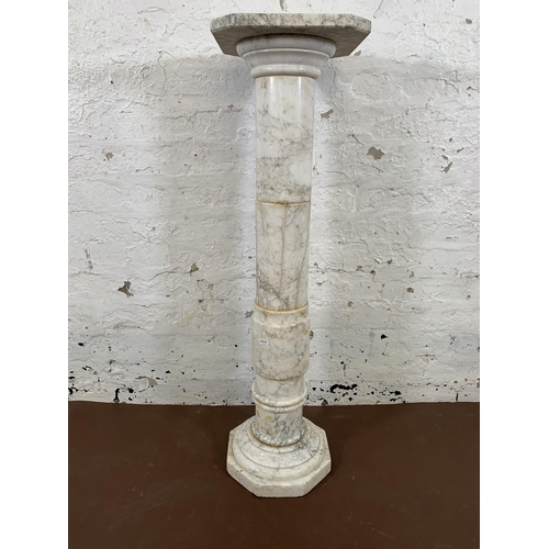 16 - A 19th century style marble column jardinière stand with octagonal top and base - approx. 100cm high... 