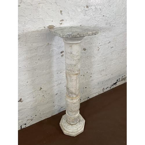 16 - A 19th century style marble column jardinière stand with octagonal top and base - approx. 100cm high... 