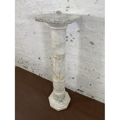 16 - A 19th century style marble column jardinière stand with octagonal top and base - approx. 100cm high... 