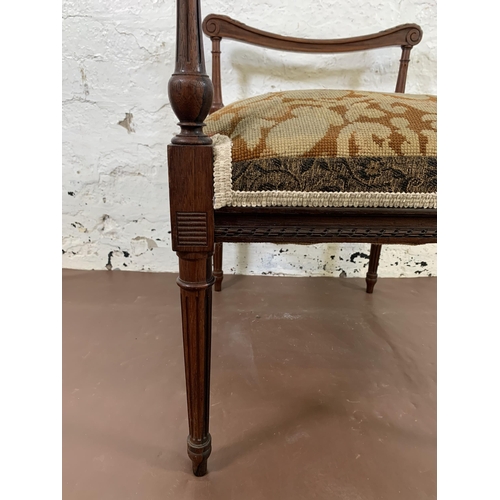 161 - A Victorian rosewood and tapestry upholstered twin handled stool - approx. 62cm high x 58cm wide x 4... 