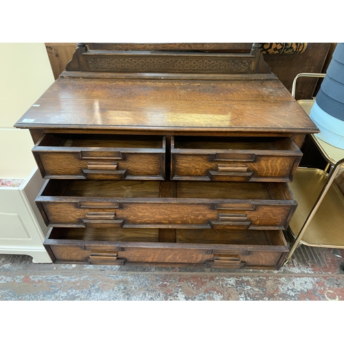 165 - An early 20th century Jacobean revival carved oak dressing table - approx. 142cm high x 106cm wide x... 