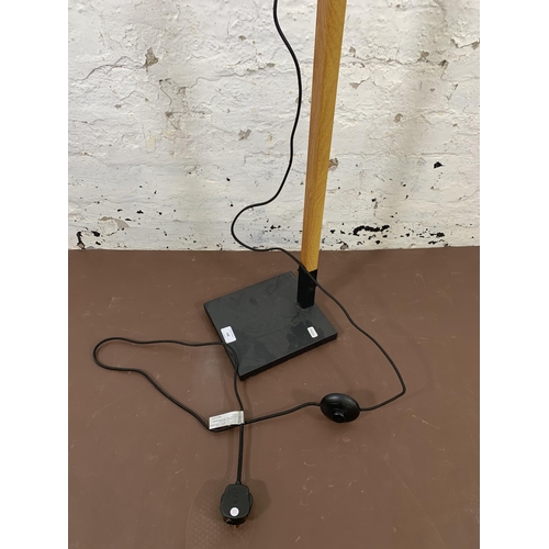 168 - A GoodHome oak effect and black metal floor lamp - approx. 126cm high