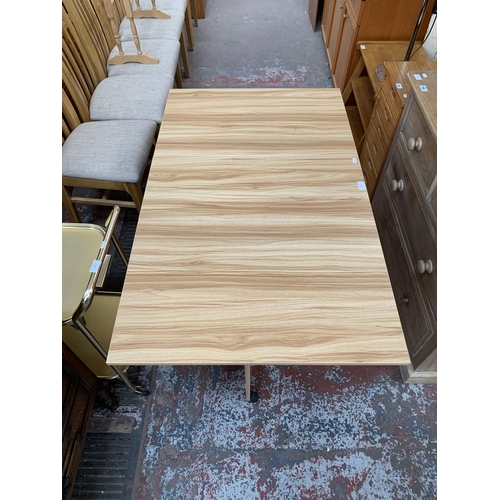 169 - A modern oak effect drop leaf dining table