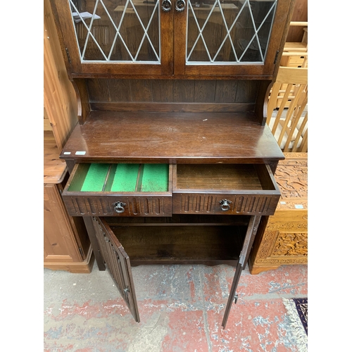 178 - A carved oak linenfold dresser - approx. 179cm high x 95cm wide x 44cm deep