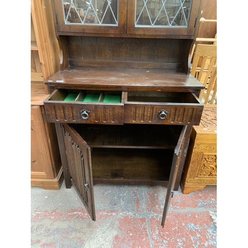 178 - A carved oak linenfold dresser - approx. 179cm high x 95cm wide x 44cm deep