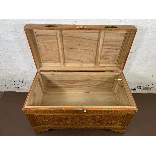 179 - A Chinese carved camphor wood blanket box - approx. 58cm high x 100cm wide x 50cm deep