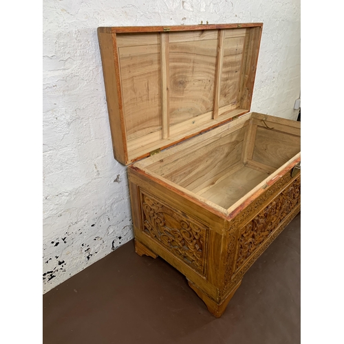 179 - A Chinese carved camphor wood blanket box - approx. 58cm high x 100cm wide x 50cm deep