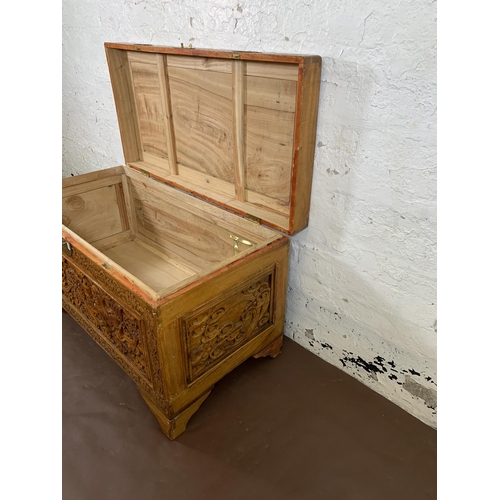 179 - A Chinese carved camphor wood blanket box - approx. 58cm high x 100cm wide x 50cm deep