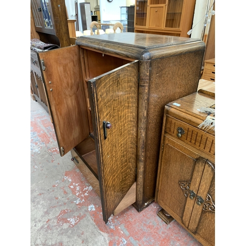 181 - An Art Deco oak two door cabinet - approx. 122cm high x 79cm wide x 48cm deep