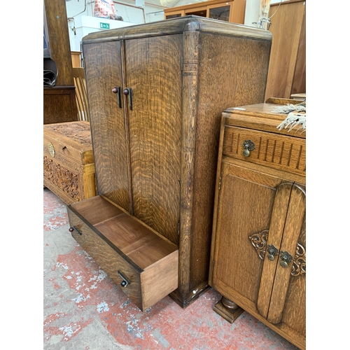 181 - An Art Deco oak two door cabinet - approx. 122cm high x 79cm wide x 48cm deep