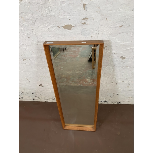 187 - A mid 20th century teak framed wall mirror - approx. 95cm x 34cm