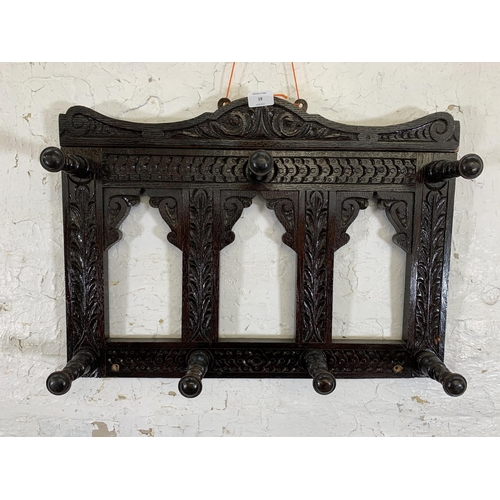 19 - A Victorian Gothic Revival style carved oak wall hanging seven hook coat rack - approx. 44cm high x ... 