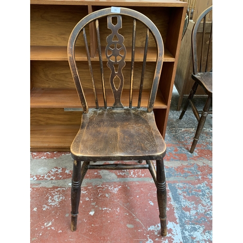 190 - Four elm and beech wheelback dining chairs