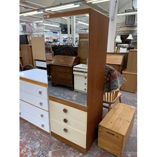 193 - A mid 20th century teak and white laminate mirror door wardrobe