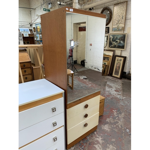 193 - A mid 20th century teak and white laminate mirror door wardrobe