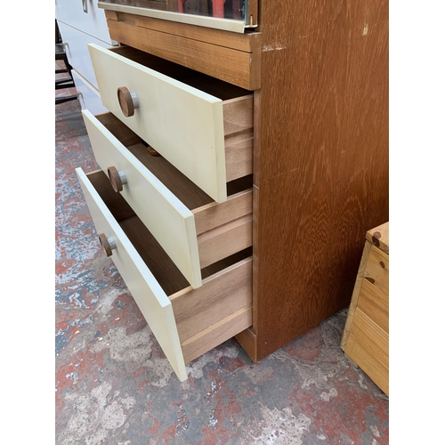 193 - A mid 20th century teak and white laminate mirror door wardrobe