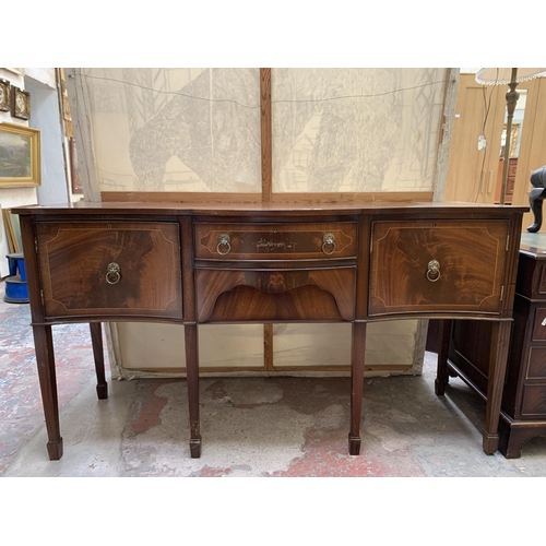 20 - A Regency style mahogany serpentine sideboard on tapering supports - approx. 92cm high x 167cm wide ... 