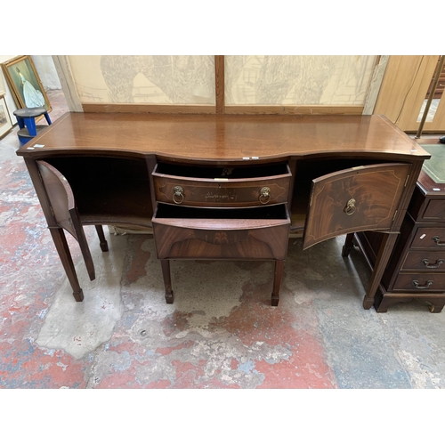 20 - A Regency style mahogany serpentine sideboard on tapering supports - approx. 92cm high x 167cm wide ... 