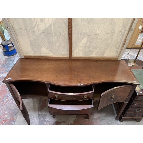 20 - A Regency style mahogany serpentine sideboard on tapering supports - approx. 92cm high x 167cm wide ... 