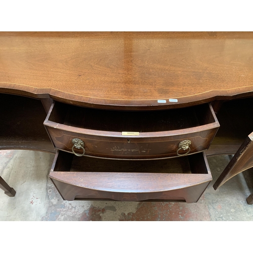 20 - A Regency style mahogany serpentine sideboard on tapering supports - approx. 92cm high x 167cm wide ... 