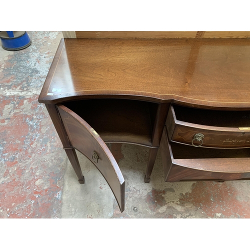 20 - A Regency style mahogany serpentine sideboard on tapering supports - approx. 92cm high x 167cm wide ... 