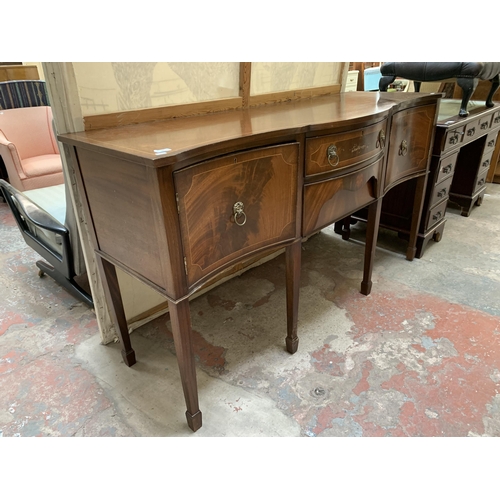 20 - A Regency style mahogany serpentine sideboard on tapering supports - approx. 92cm high x 167cm wide ... 