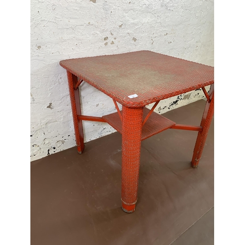 200 - A mid 20th century Lloyd Loom red painted square occasional table - approx. 69cm high x 70cm square