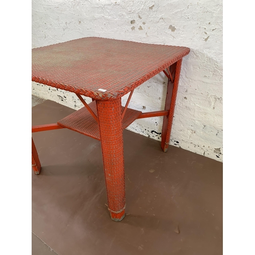 200 - A mid 20th century Lloyd Loom red painted square occasional table - approx. 69cm high x 70cm square