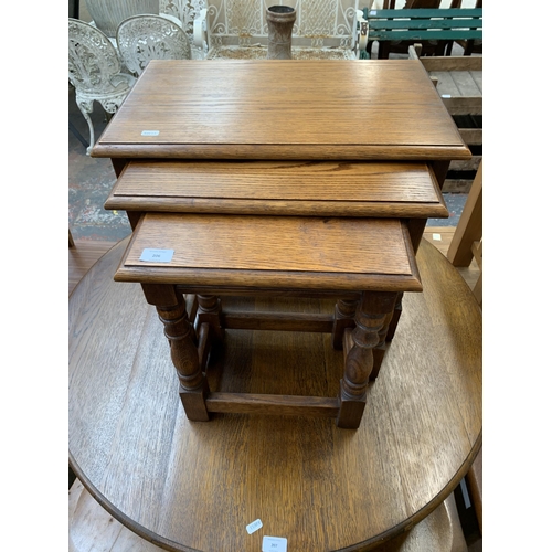 206 - A 17th century style oak nest of tables - approx. 48cm high x 54cm wide x 35cm deep