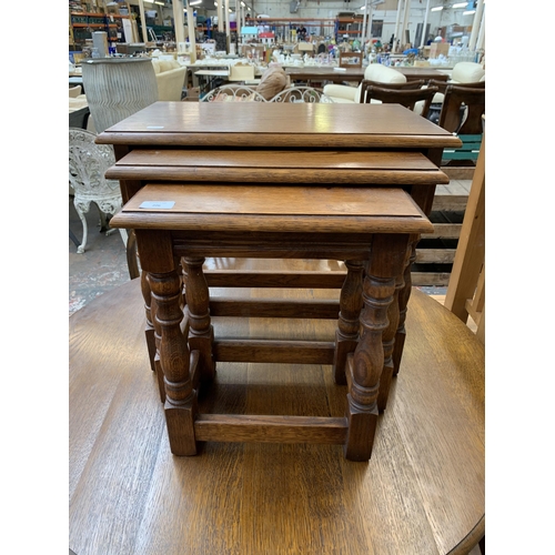 206 - A 17th century style oak nest of tables - approx. 48cm high x 54cm wide x 35cm deep