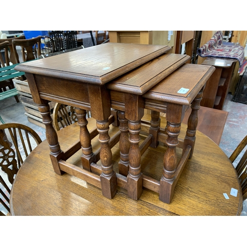 206 - A 17th century style oak nest of tables - approx. 48cm high x 54cm wide x 35cm deep