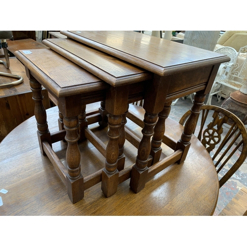 206 - A 17th century style oak nest of tables - approx. 48cm high x 54cm wide x 35cm deep