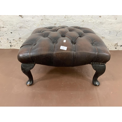 21 - A brown leather Chesterfield footstool on cabriole supports - approx. 30cm high x 60cm wide x 60cm d... 