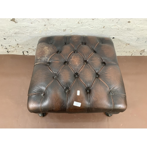 21 - A brown leather Chesterfield footstool on cabriole supports - approx. 30cm high x 60cm wide x 60cm d... 