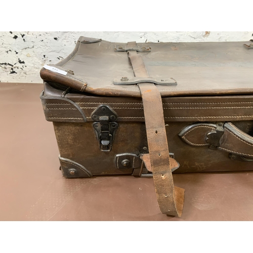 212 - An early 20th century brown leather travel trunk - approx. 26cm high x 86cm wide x 48cm deep