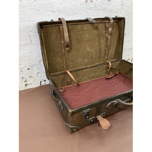 212 - An early 20th century brown leather travel trunk - approx. 26cm high x 86cm wide x 48cm deep