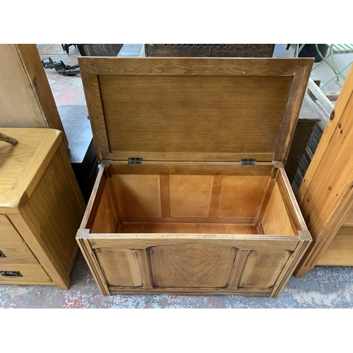 213 - A mid 20th century oak blanket box - approx. 51cm high x 89cm wide x 48cm deep