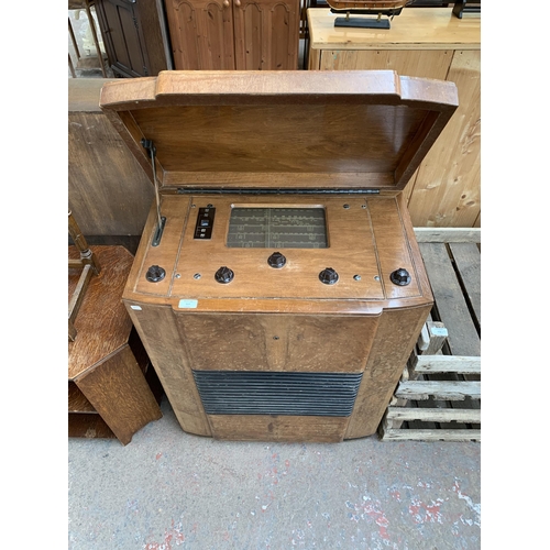 217 - An Art Deco Radio Gramophone Development Co. Ltd. R.G.D.10 walnut cased floor standing valve radio -... 